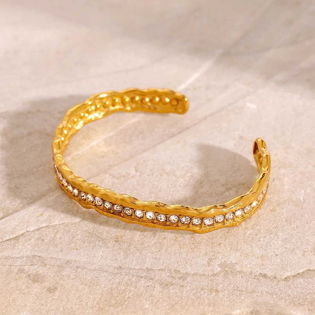 European-style hammered bracelet featuring brilliant-cut stones in a refined gold-plated finish.