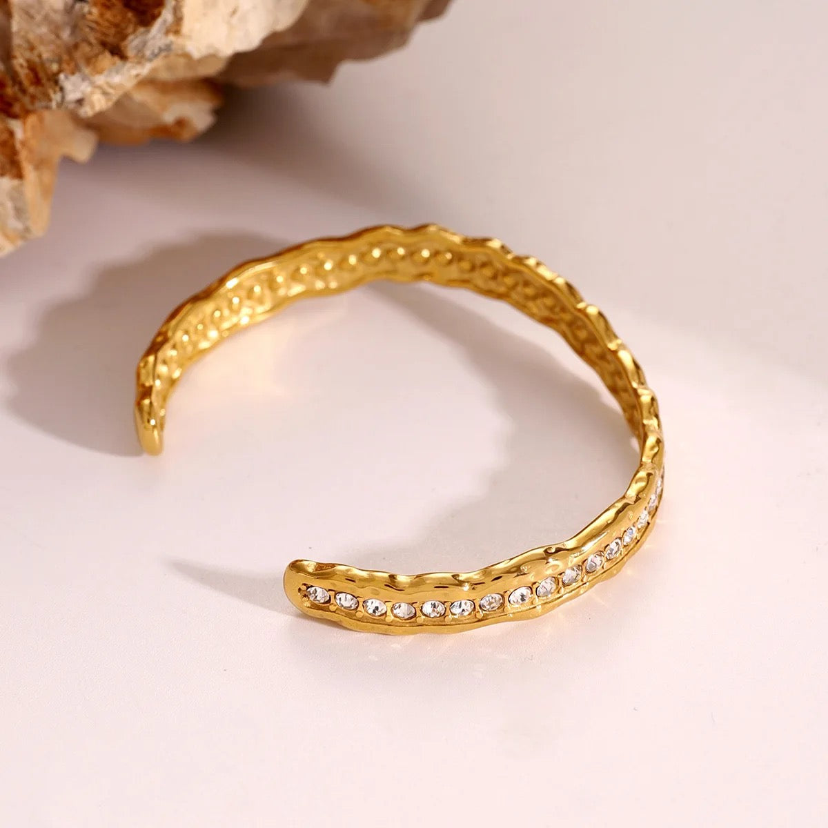 European-style hammered bracelet featuring brilliant-cut stones in a refined gold-plated finish.