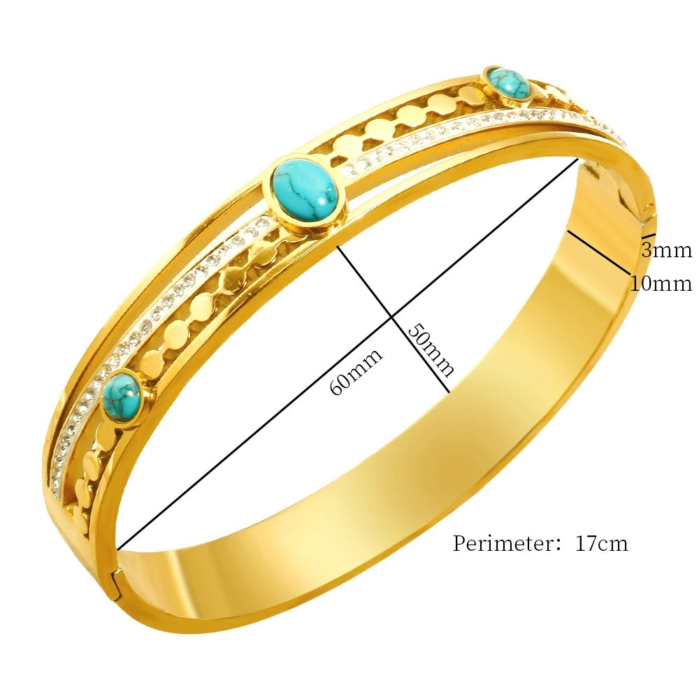 Stylish bracelet featuring a vibrant turquoise stone, set in a sleek gold-plated design